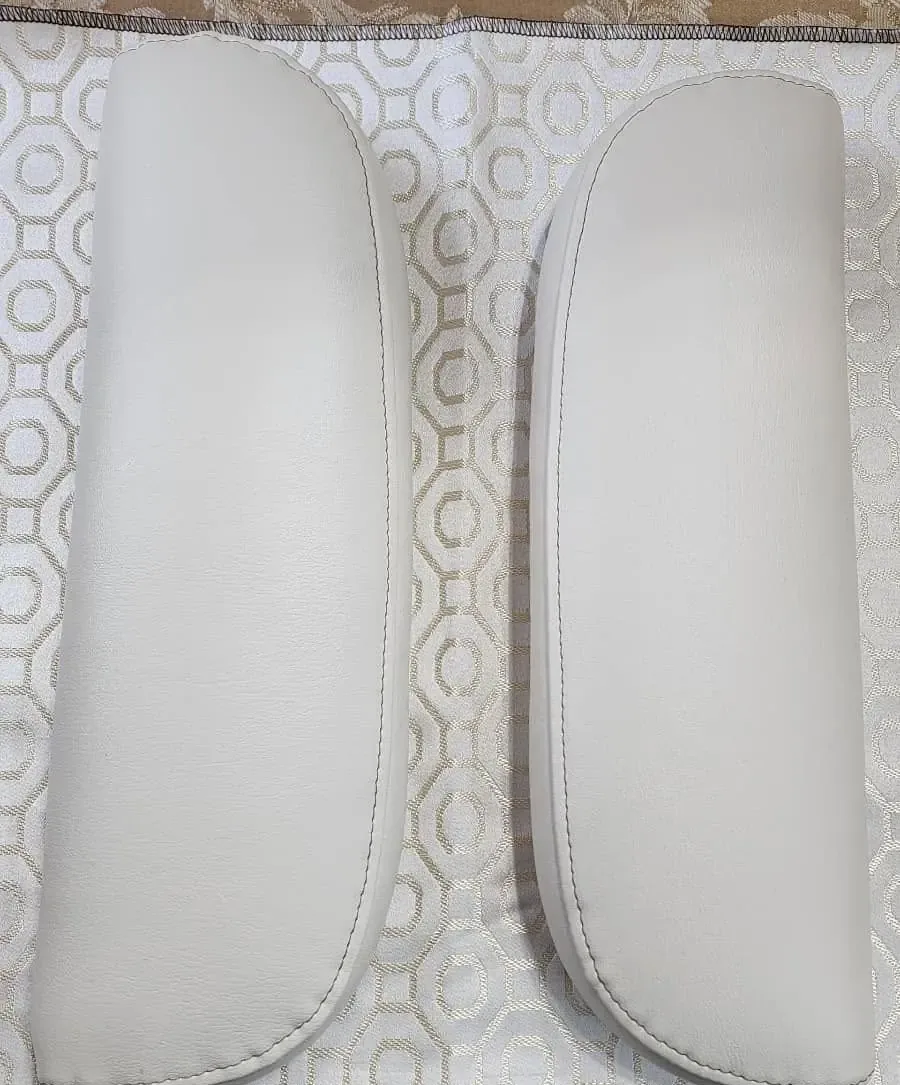 Pair of white marine vinyl bench cushions freshly upholstered by Da Kine Upholstery.