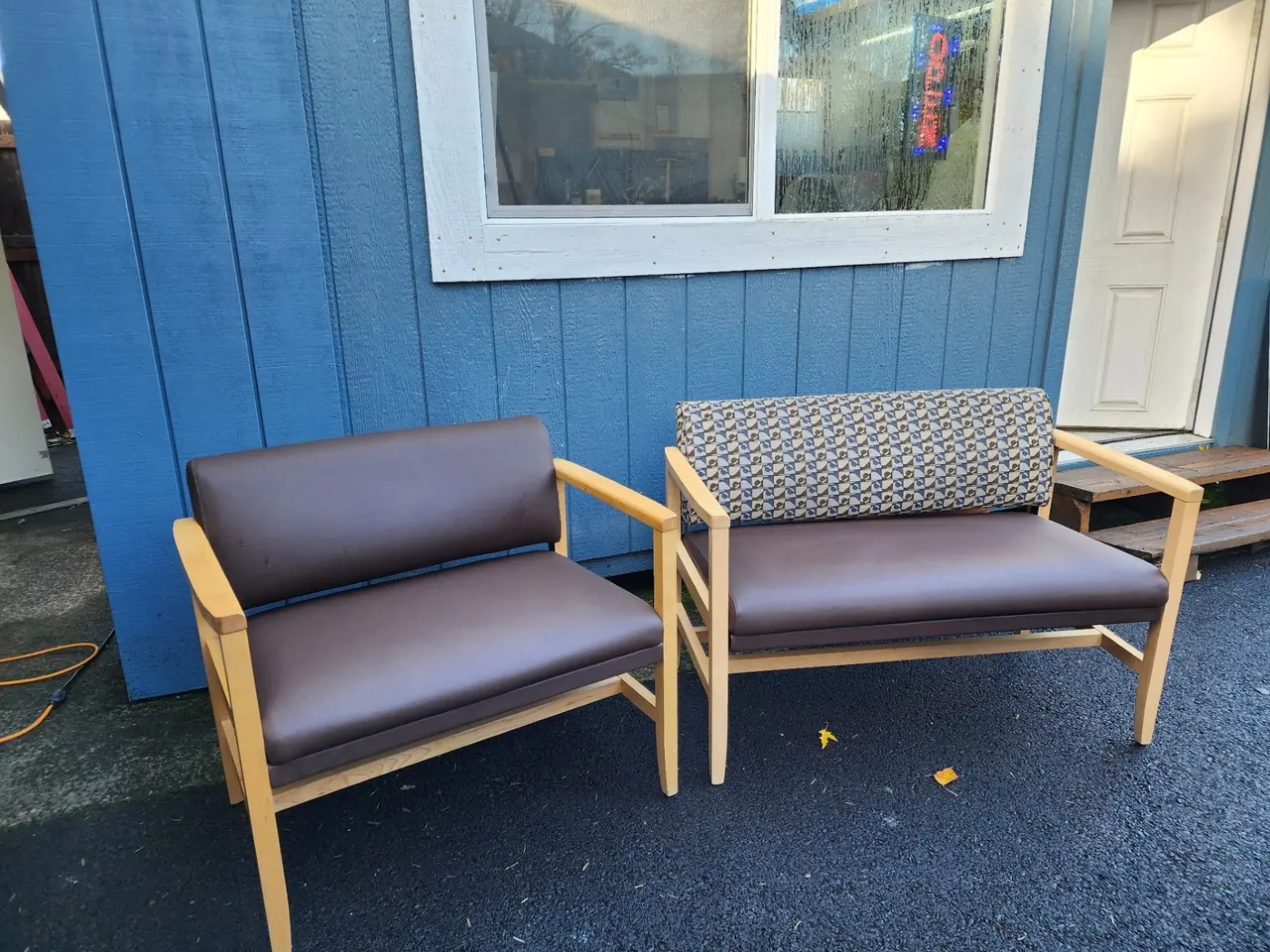 Pair of commercial waiting room benches reupholstered in brown vinyl with wood frames.