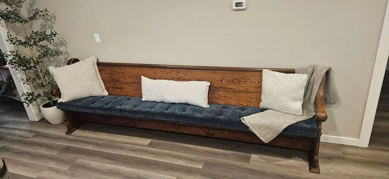 Long antique wood bench frame ready for a new cushion.