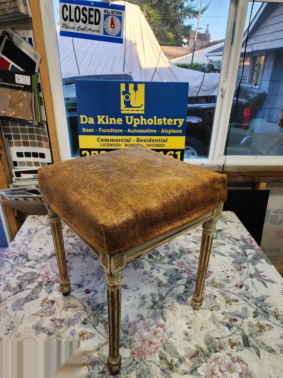 Worn gold-brown suede vanity bench seat before restoration.