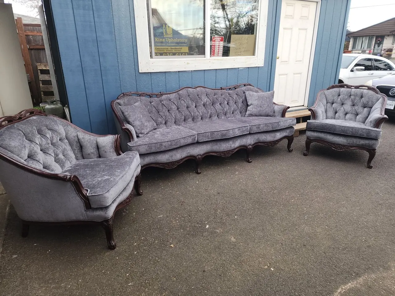 Antique sofa and two matching armchairs reupholstered in gray chenille velvet.