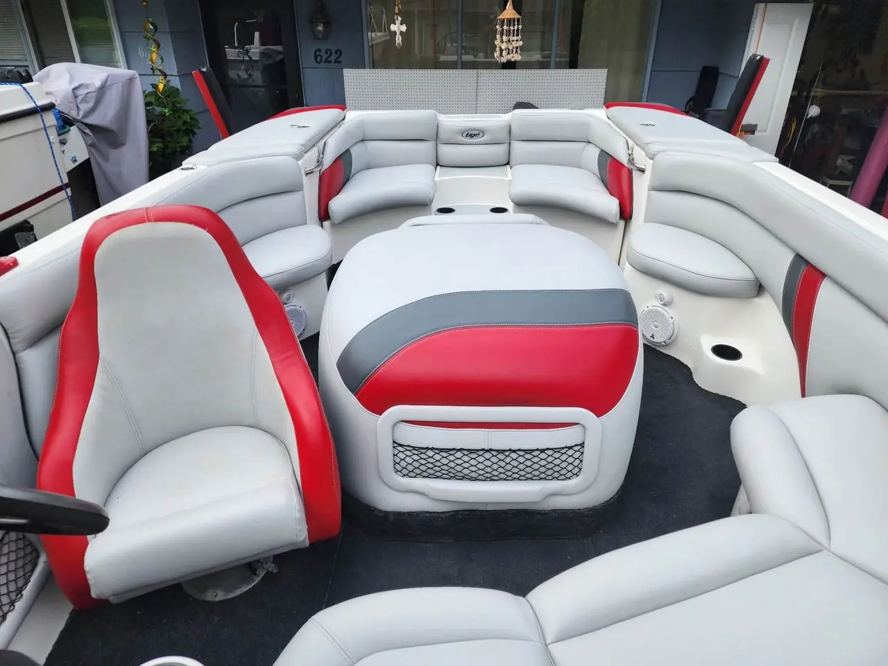 Restored Tigé wakeboard boat interior with white, gray, and red marine upholstery by Da Kine Upholstery