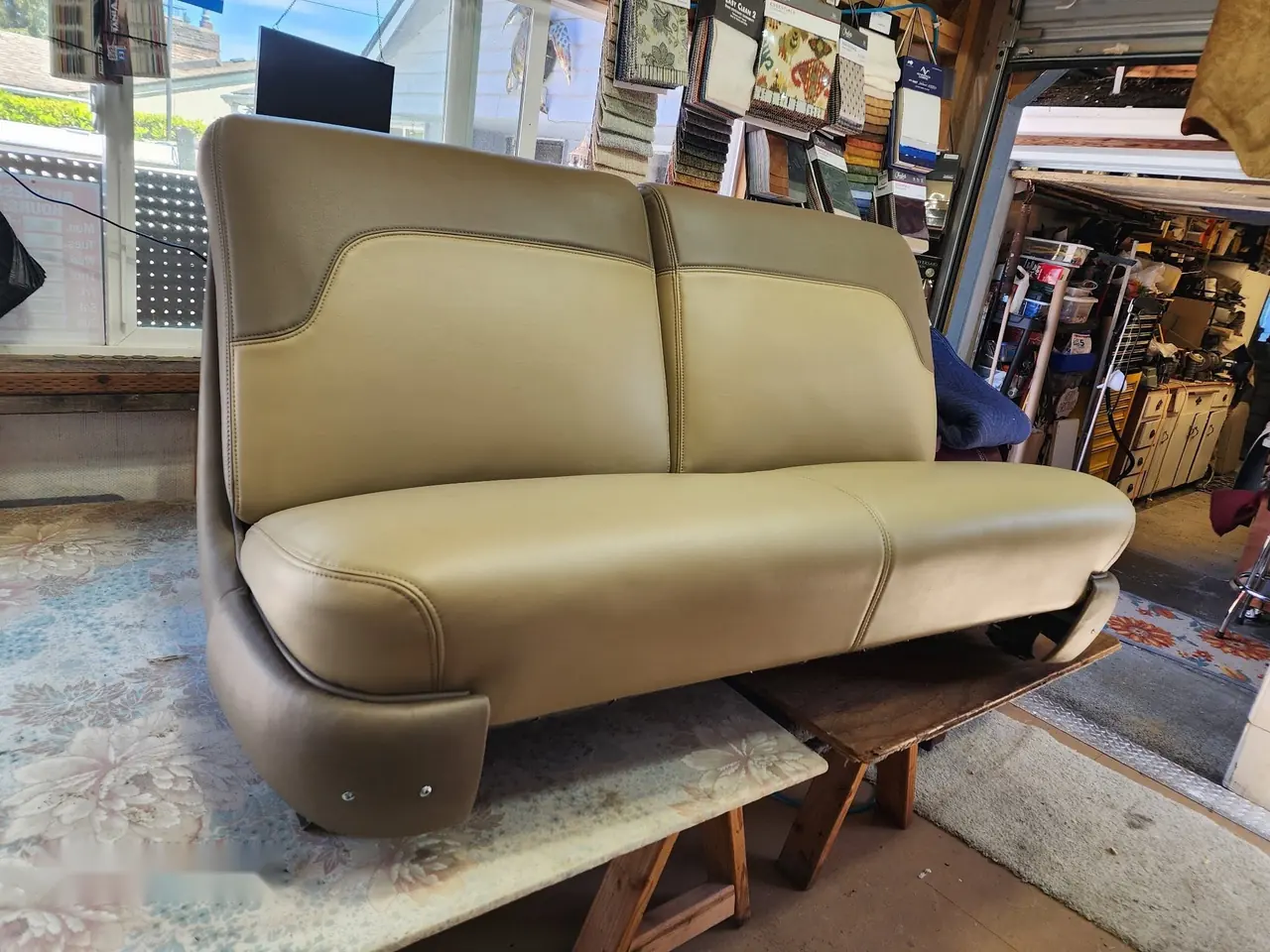 Truck bench seat reupholstered in tan vinyl with clean, factory-style stitching.